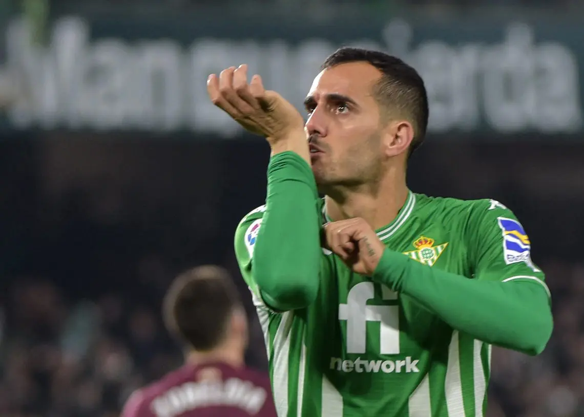 Real Betis' Spanish forward Juanmi celebrates after scoring a goal during the Spanish league football match between Real Betis and Real Sociedad at the Benito Villamarin stadium in Seville on December 12, 2021. (Photo by CRISTINA QUICLER / AFP)