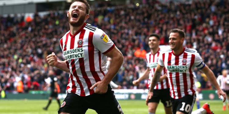 SHEFFIELD, ENGLAND - APRIL 27:  Jack O'Connell of Sheffield United (5) celebrates after scoring his team's second goal during the Skybet Championship match between Sheffield United and Ipswich Town at Bramall Lane on April 27, 2019 in Sheffield, England. (Photo by Jan Kruger/Getty Images)